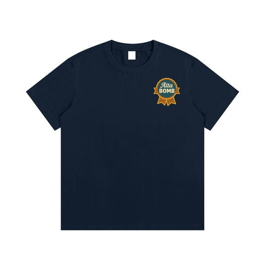 Front view of blue square Alta Bomb après ski tee with front badge emblem.