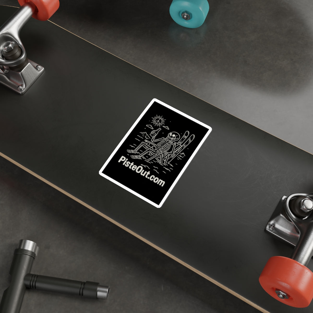 Chill to the Bone sticker applied to black skateboard deck