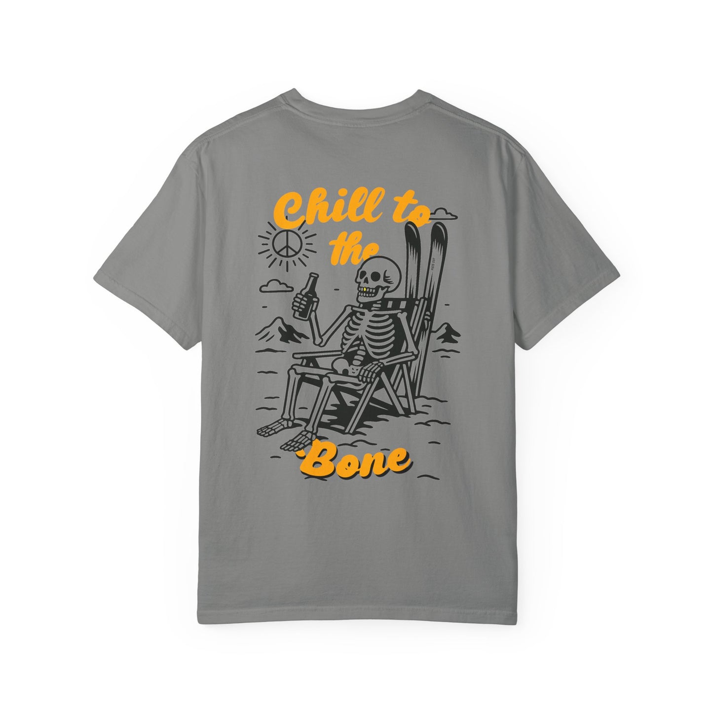 Back of grey tee featuring laid-back skeleton with skis, beer, and bold “Chill to the Bone” graphic