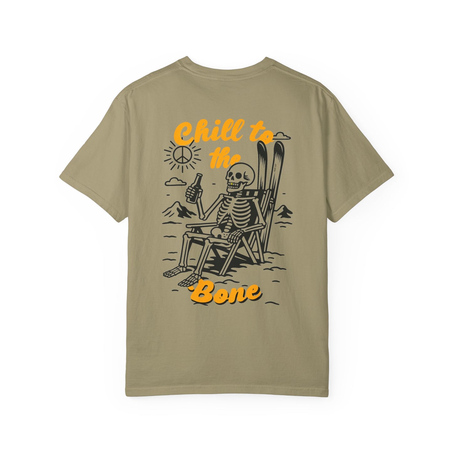 Back of khaki tee featuring laid-back skeleton with skis, beer, and bold “Chill to the Bone” graphic