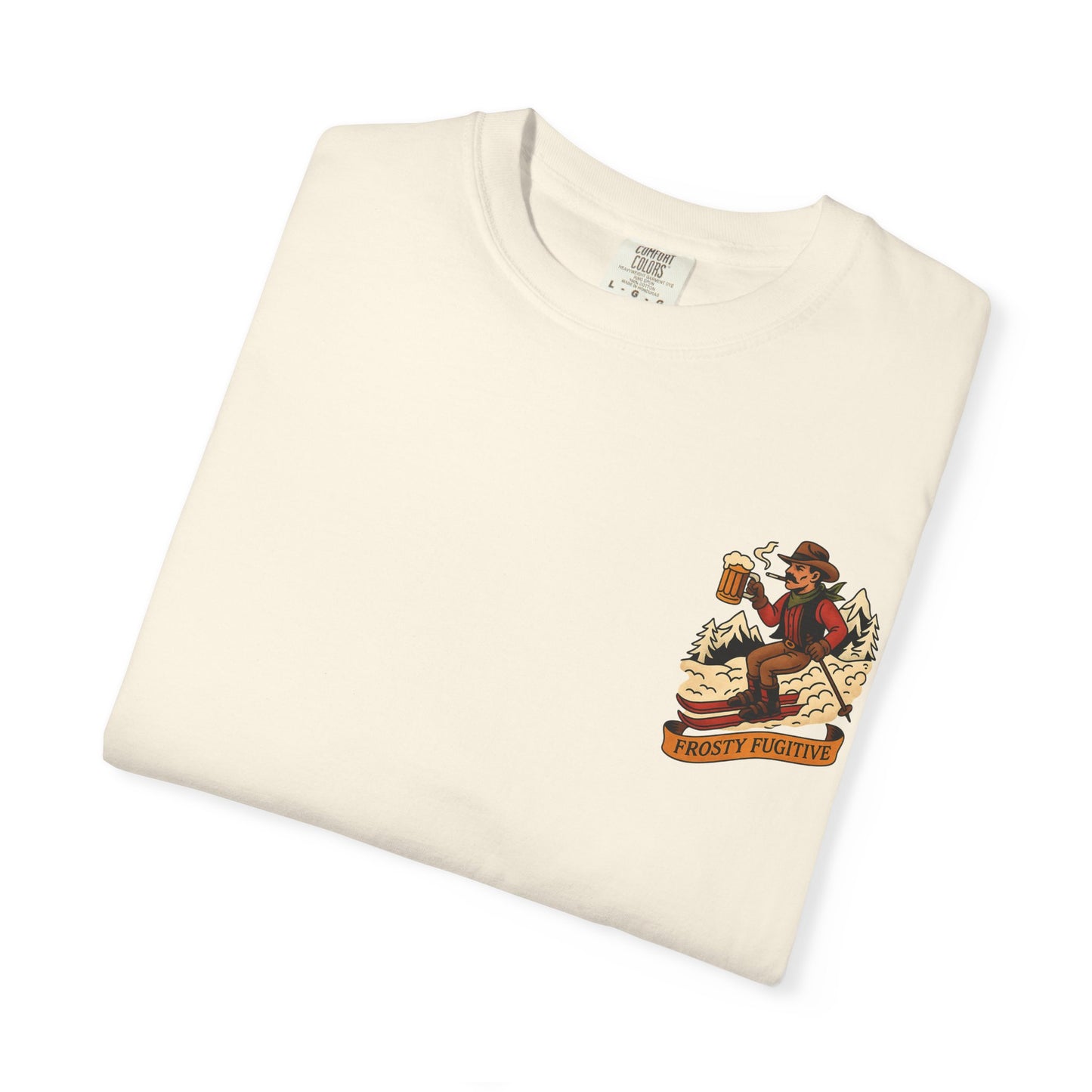 Cream tee folded flat showing front chest graphic of ski outlaw with beer and "Frosty Fugitive" banner