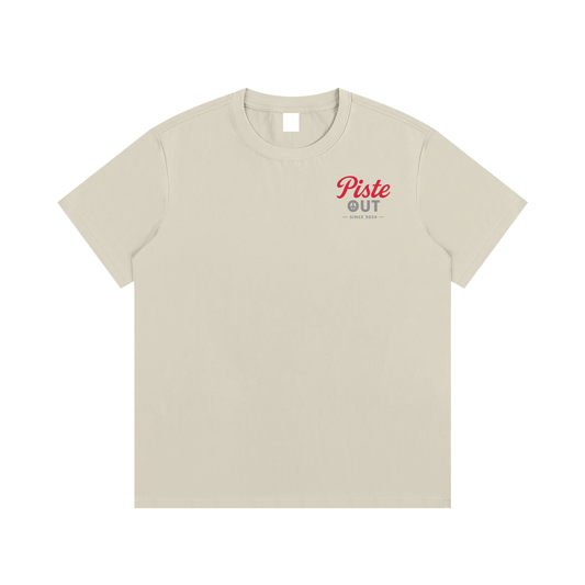 Front view of khaki High Calorie Sports Drink après ski tee with red Piste Out logo printed on left chest.