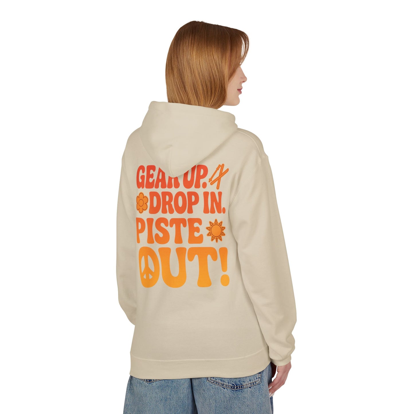 Model wearing cream hoodie, back view showing large orange slogan