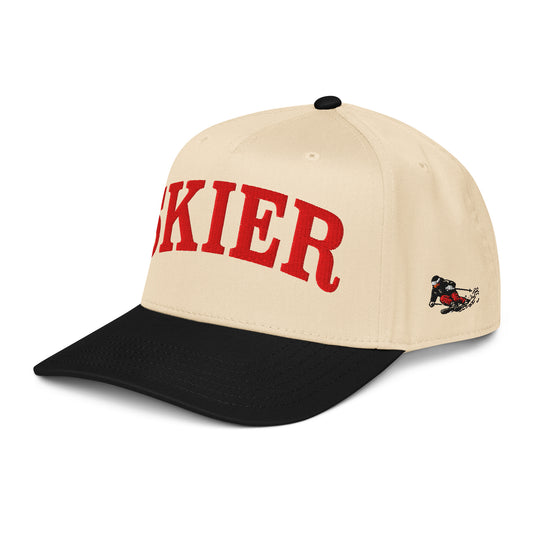 Skier Cap in Black Diamond, angled front view showing vintage downhill skier side panel graphic