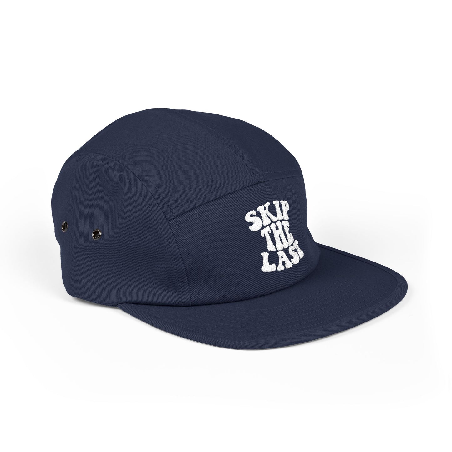 Side view of navy blue Skip the Last 5-panel camper hat with embroidered ski superstition slogan.