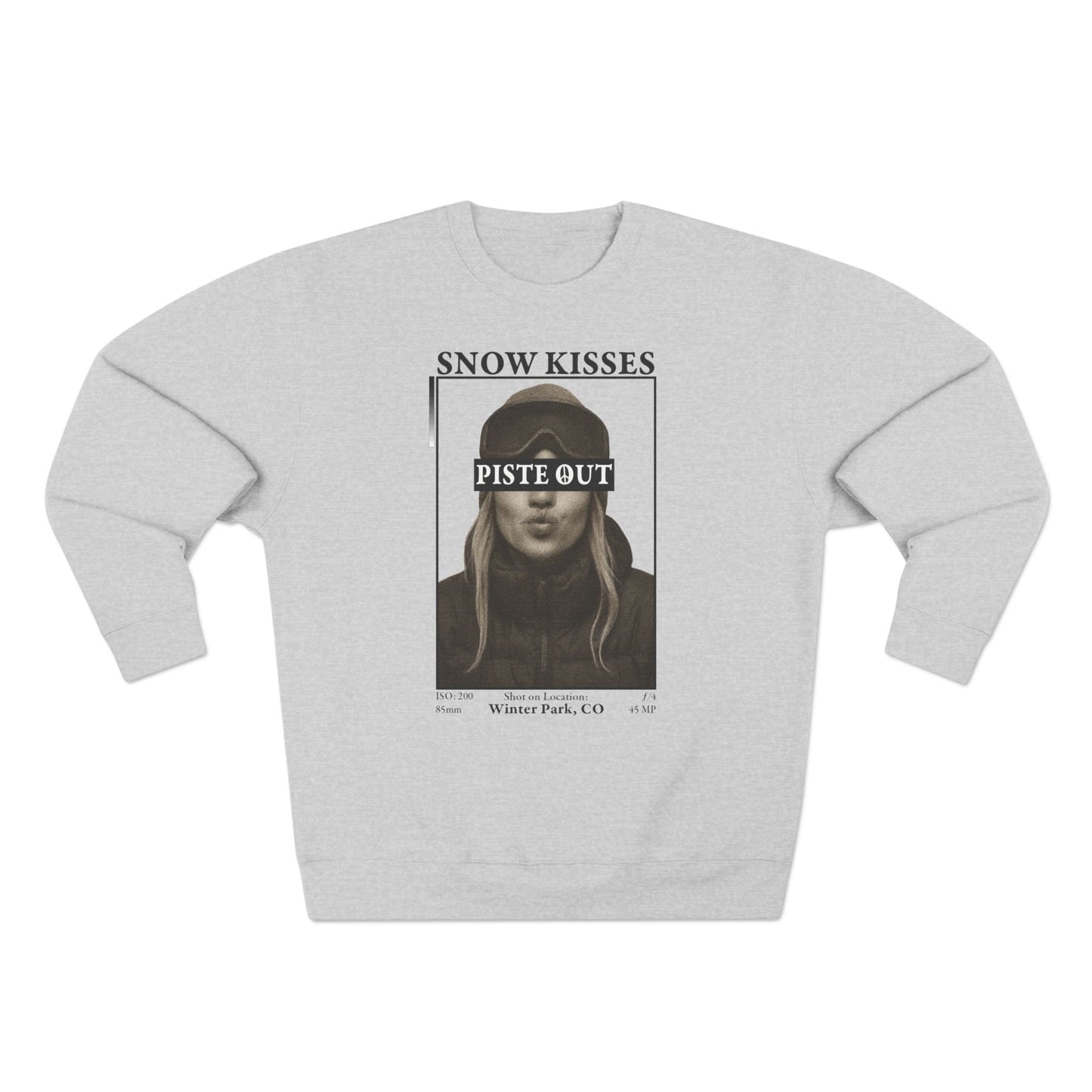 Front view of heather gray Snow Kisses crewneck sweatshirt with vintage ski graphic and Piste Out logo.