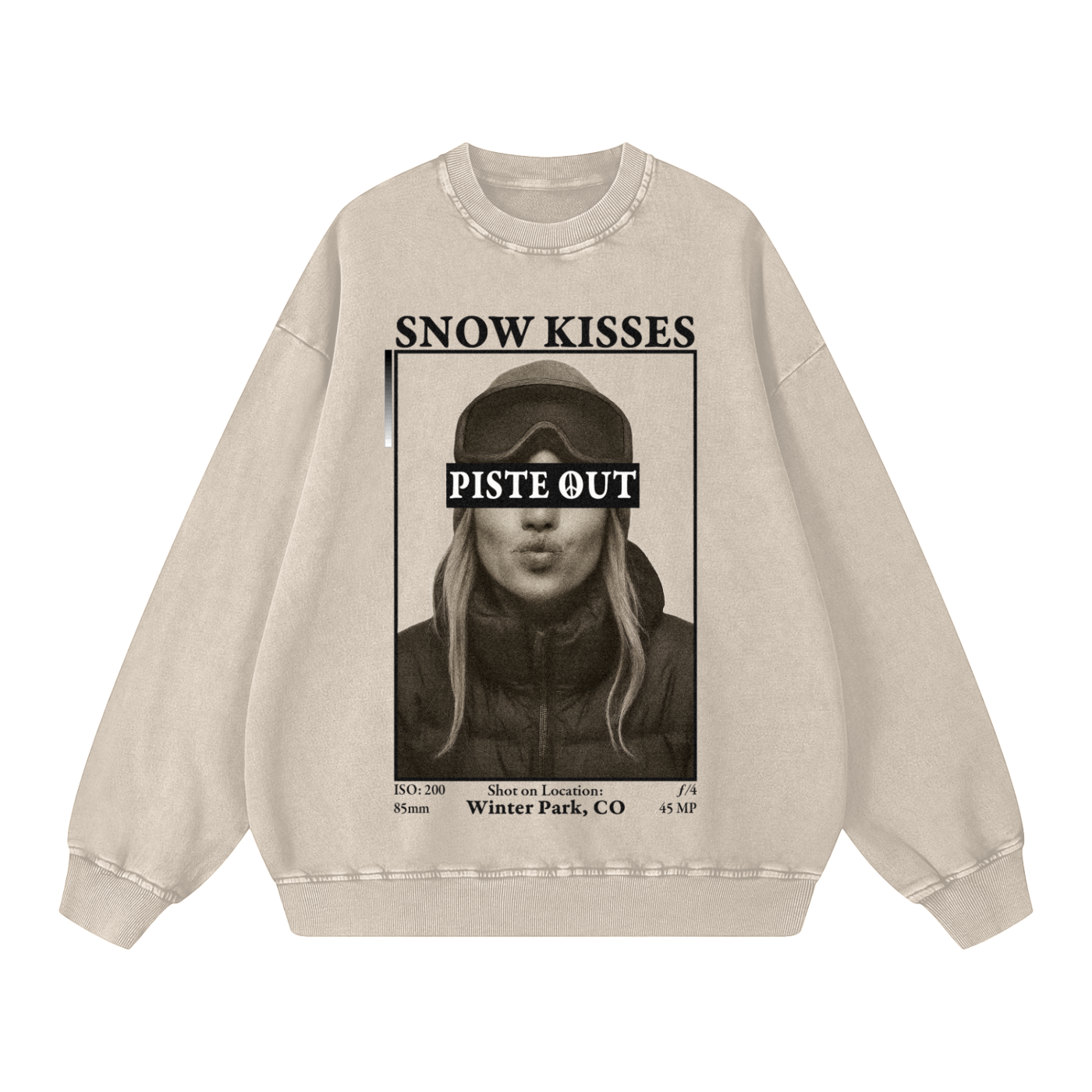 Front view of light apricot Snow Kisses vintage crewneck featuring ski town crush graphic and Piste Out logo across goggles.