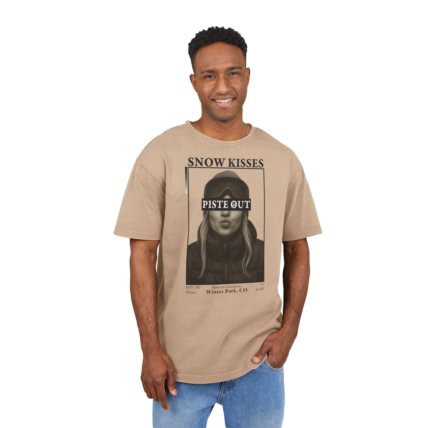 Model wearing Union Beige Snow Kisses Piste Out graphic ski t-shirt, front view.