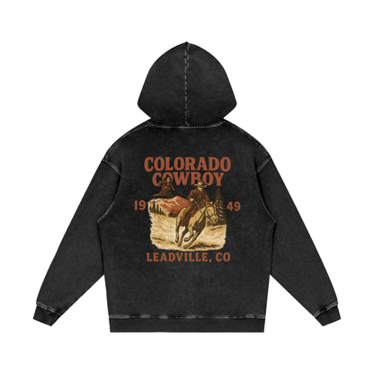 Back view of faded black diamond Colorado Cowboy hoodie with vintage rodeo graphic reading “Colorado Cowboy, Leadville CO, 1949.”