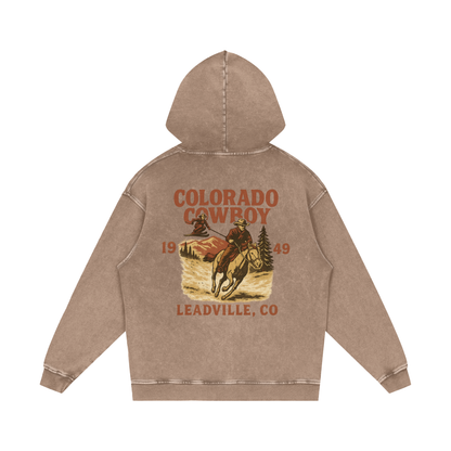 Back view of sand Colorado Cowboy hoodie with aged rodeo poster-style cowboy design and Leadville, Colorado lettering.