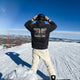 Male snowboarder wearing the Grand Line Hoodie in Black Dimond at the top of a ski trail. 