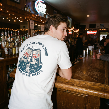 Model wearing Snow white high calorie sports drink in a bar