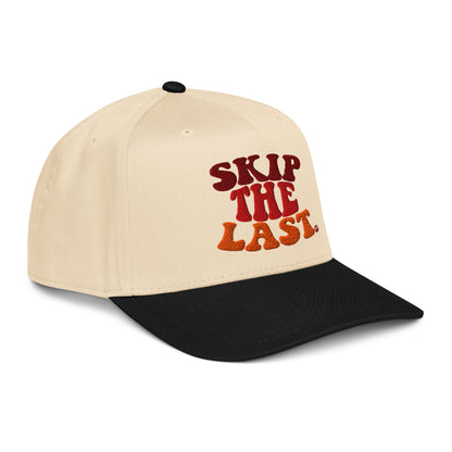 Right angled view of the Skip the Last hat in Black Diamond, cream crown, black brim, and gradient front text.