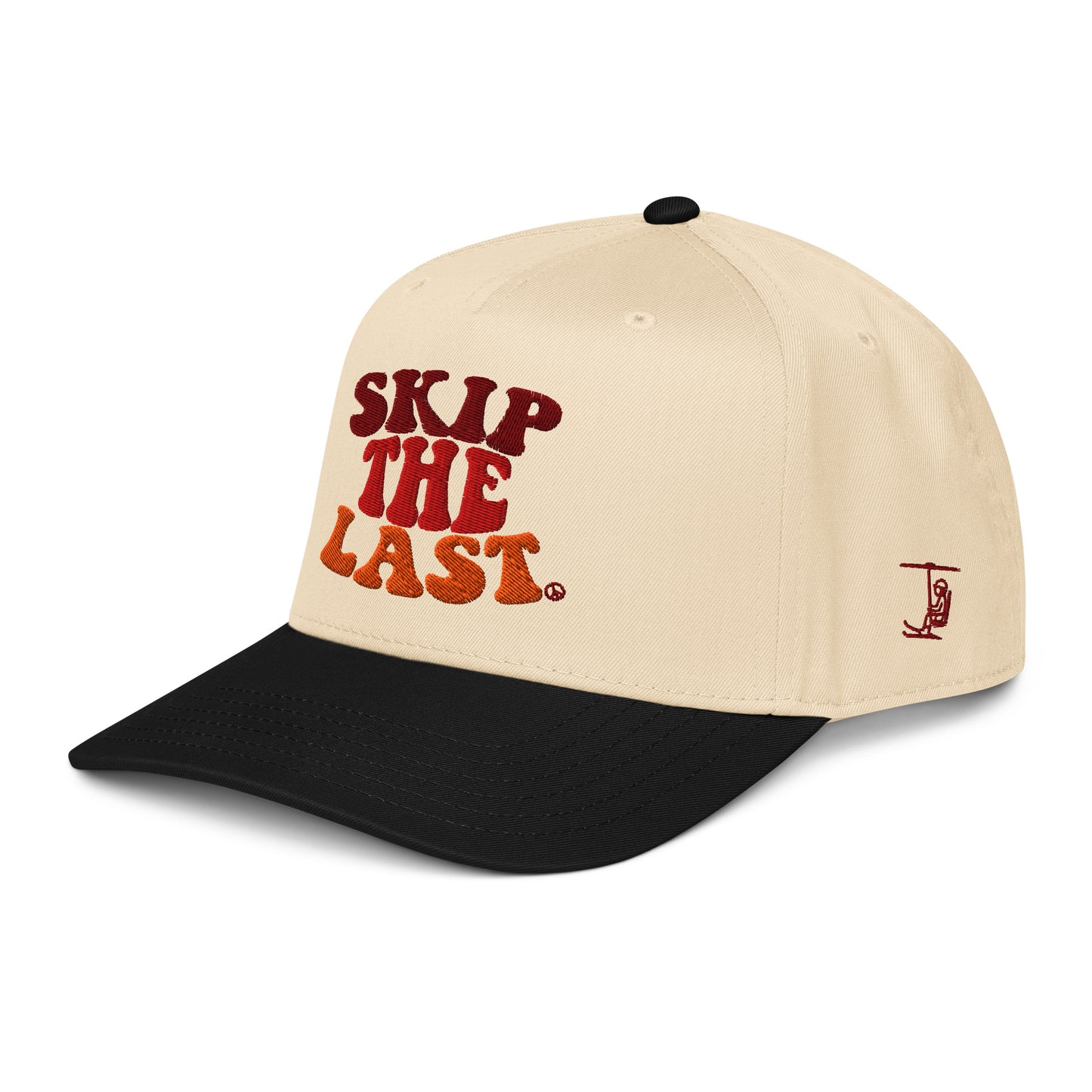 Angled view of the Skip the Last hat in Black Diamond, showing the side skier embroidery, cream crown, black brim, and gradient front text.