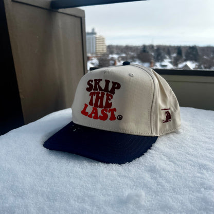 Front of the blue square skip the last hat in the snow. 
