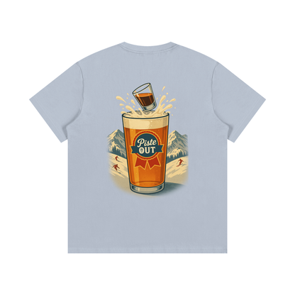 Back view of blue bird Alta Bomb tee showing beer splash graphic and Piste Out logo.