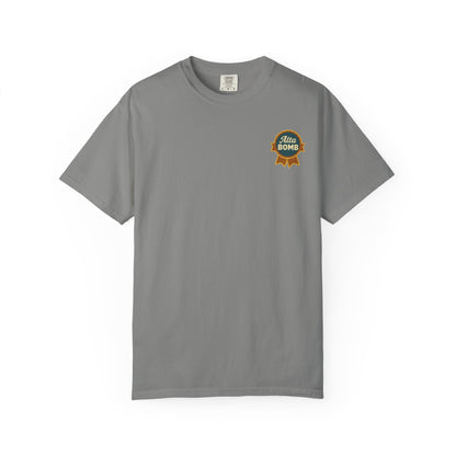 Flat lay gray Alta Bomb t-shirt with chest ribbon badge detail.