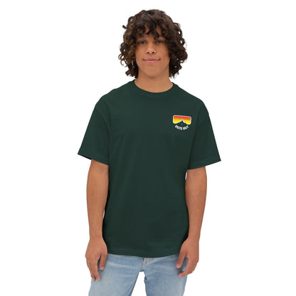 Model wearing green oversized ski shirt with logo on chest