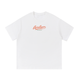 Snow white Après Aspen ski tee front view with coral Après Aspen logo and green Colorado text.