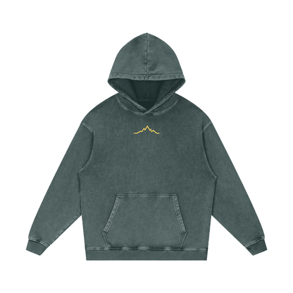 Front view of Green Circle Backcountry Veins hoodie with subtle gold mountain line logo on chest.