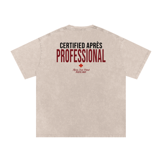 Back view of the Certified Après Professional tee in Apricot with a bold Certified Après Professional statement and Après Shot Patrol detail.
