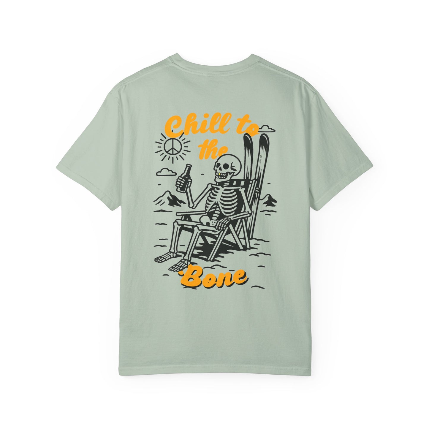 Back of sage green tee with bold Chill to the Bone graphic featuring skeleton in ski chair