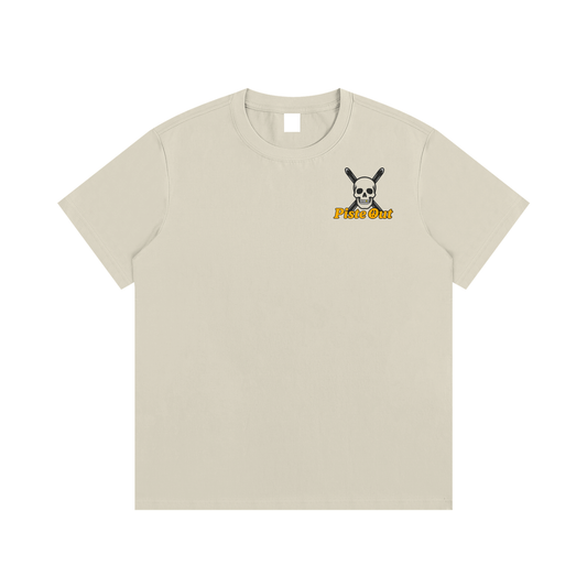 Front view of khaki Chill to the Bone tee with skull and ski pole emblem and orange Piste Out logo text.