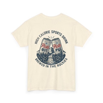 Back view of High Calorie Sports Drink tee in natural oatmeal with two Piste Out cans, mountain scene, and “Brewed in the Rockies” slogan.