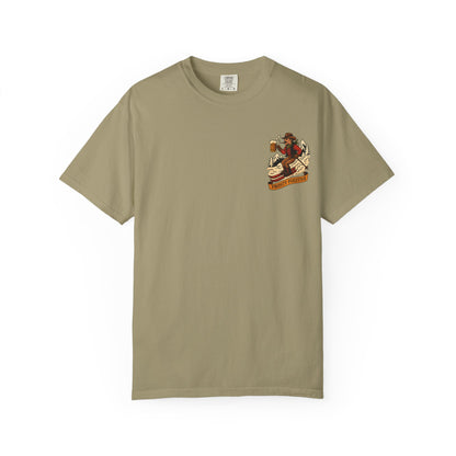 Front of khaki tee with small vintage ski outlaw holding a beer and a "Frosty Fugitive" banner printed on left chest