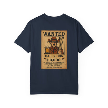 Back of navy blue tee featuring retro “WANTED” poster of a cowboy holding a beer and skis
