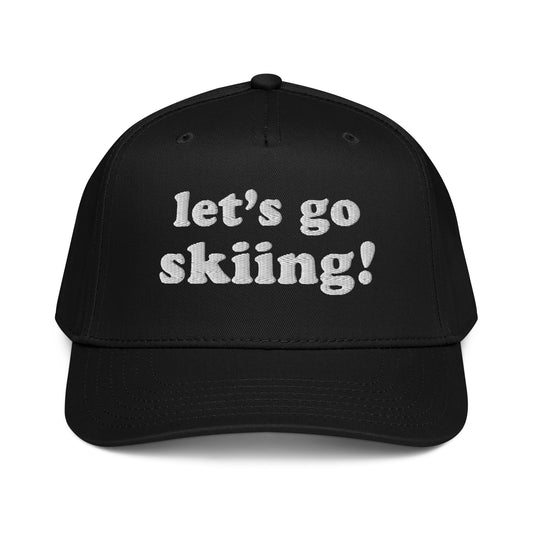 Front view of the Let’s Go Skiing! Hat in Black with white embroidered “let’s go skiing!” text on a classic ski lifestyle cap.