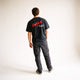 Male model standing and facing away from the camera, wearing the DARE short sleeve tee.