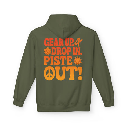 Back of olive green hoodie with large retro orange “Gear Up. Drop In. Piste Out!” slogan print