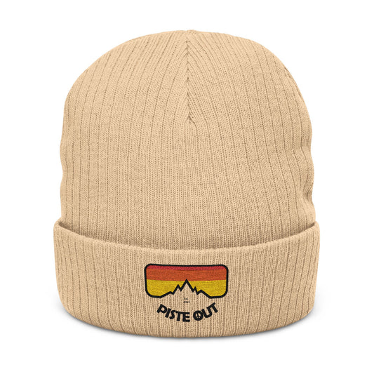 Front of beige ribbed beanie with embroidered retro goggle logo patch