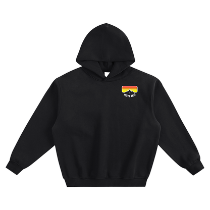 Front view of Black Diamond Piste Out Logo Hoodie with retro ski goggle graphic (red–orange–yellow gradient) and white mountain silhouette.