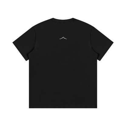 Back view of black Piste Out logo tee in solid black with no visible back graphic.