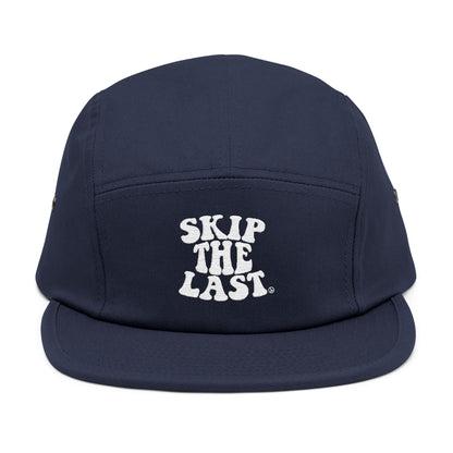 Front view of navy blue Skip the Last 5-panel ski superstition hat with white embroidered text.