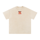 Skip the Last Oversized Boxy Tee in Tan with Skip the Last chest logo, front view