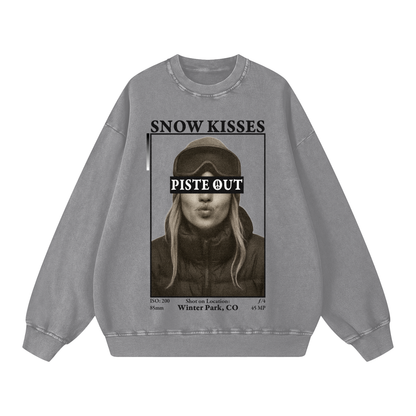Front view of light gray Snow Kisses crewneck with ski town crush print and Piste Out logo.