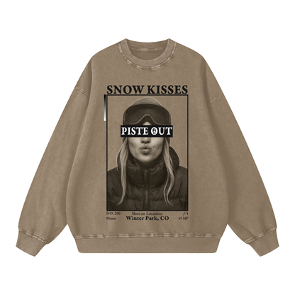 Front view of stone gray Snow Kisses vintage crewneck featuring bold ski town crush design and Piste Out text overlay.