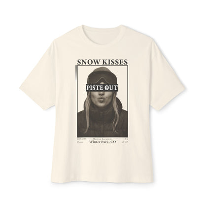 Snow Kisses graphic t-shirt in cream with ski portrait print and bold Piste Out branding.