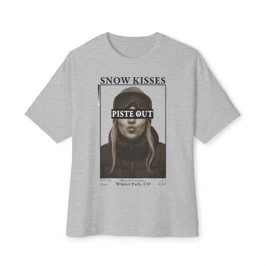 Snow Kisses graphic t-shirt in gray featuring black and white ski portrait with Piste Out text.