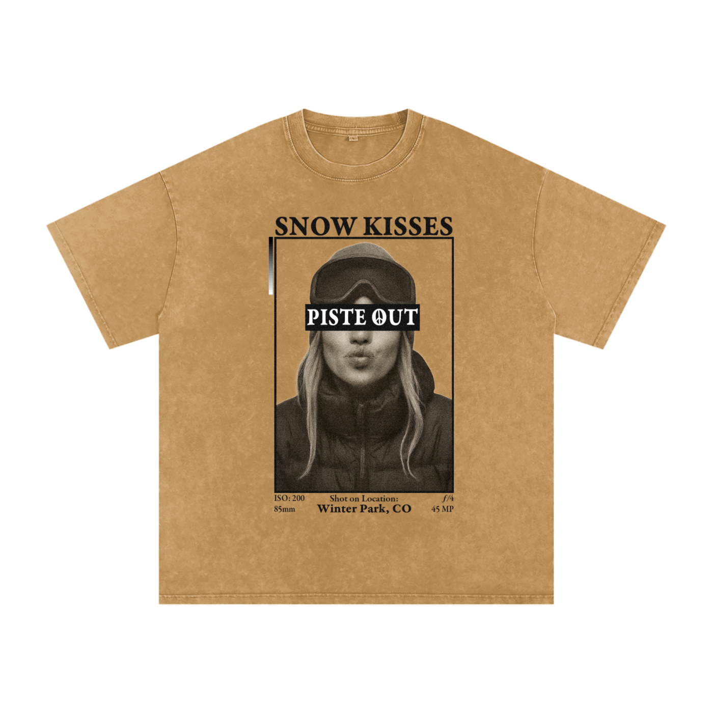 Front view of Mustard yellow Snow Kisses tee featuring black-and-white ski town crush design with Piste Out text overlay.