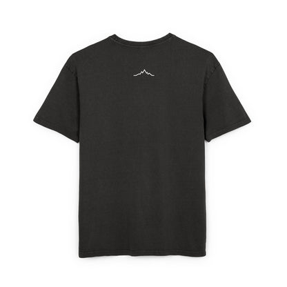 Back of black tee showing minimalist mountain line logo under collar