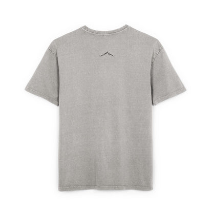 Back of grey tee showing minimalist mountain line logo under collar