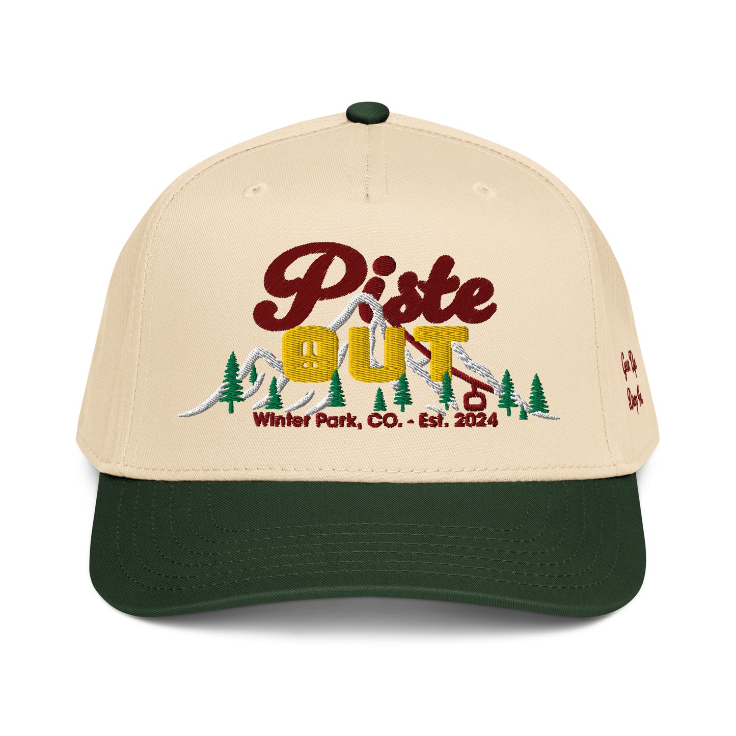 Front view of cream and forest green Sunset Hat featuring embroidered Piste Out logo with sunset gradient text and ski lift design, Winter Park CO Est. 2024.