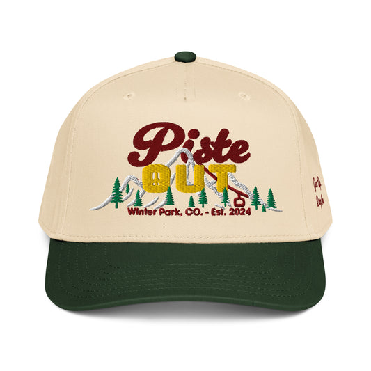 Front view of Green Circle Sunset Peaks snapback cap featuring a cream crown, dark green brim, and colorful embroidered mountain logo.